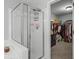Bathroom features a glass enclosed shower next to a walk in closet at 865 Ashfield Dr, Decatur, GA 30030