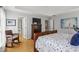 Bedroom with hardwood floors, a dresser with a television, and a comfortable king-size bed at 865 Ashfield Dr, Decatur, GA 30030