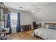 Bedroom with vaulted ceilings, hardwood floors, a ceiling fan, and a large window at 865 Ashfield Dr, Decatur, GA 30030
