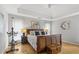 Primary bedroom featuring tray ceilings, hardwood floors, and a comfortable king-size bed at 865 Ashfield Dr, Decatur, GA 30030