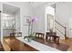 Dining room with hardwood floors, a large wooden table, and a view into the kitchen and staircase at 865 Ashfield Dr, Decatur, GA 30030