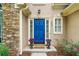 Close-up of a vibrant blue front door with stylish planters, enhancing the home's curb appeal with a stone facade at 865 Ashfield Dr, Decatur, GA 30030