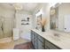 Well-lit bathroom with double vanities, a soaking tub, walk-in shower, and sleek pendant lighting at 2143 Yancey Ne Ln, Atlanta, GA 30319