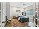 Well-lit bedroom featuring a bed, antique chest, and unique rug near windows that get great light at 2143 Yancey Ne Ln, Atlanta, GA 30319