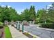 View of the community entrance gate with manicured landscaping and secure access at 2143 Yancey Ne Ln, Atlanta, GA 30319