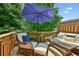 Relaxing outdoor deck with comfortable seating and a large umbrella for shade at 2143 Yancey Ne Ln, Atlanta, GA 30319