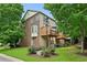 Charming townhome featuring a brick accent, private deck, and lush landscaping, nestled in a peaceful neighborhood at 2143 Yancey Ne Ln, Atlanta, GA 30319