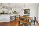 Bright kitchen and dining area featuring white cabinets, granite countertops, and hardwood floors at 2143 Yancey Ne Ln, Atlanta, GA 30319