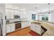 Modern kitchen with granite countertops, stainless steel appliances, and bright white cabinets at 2143 Yancey Ne Ln, Atlanta, GA 30319