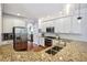 Well-equipped kitchen features stainless steel appliances, granite countertops, and white cabinetry at 2143 Yancey Ne Ln, Atlanta, GA 30319