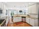 Open kitchen with stainless steel appliances, granite counters, and seamless flow to living spaces at 2143 Yancey Ne Ln, Atlanta, GA 30319