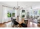 Sunlit living room with a fireplace, large windows, hardwood floors and an open concept design at 2143 Yancey Ne Ln, Atlanta, GA 30319
