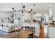 Open concept living space connecting kitchen and dining area, filled with natural light at 2143 Yancey Ne Ln, Atlanta, GA 30319