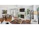 Inviting living room with fireplace, large windows, hardwood floors, and comfortable seating at 2143 Yancey Ne Ln, Atlanta, GA 30319