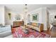 Cozy living room boasting hardwood floors, designer furniture, a chandelier, and decorative accents at 2143 Yancey Ne Ln, Atlanta, GA 30319