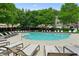 Community pool with ample lounge chairs, perfect for relaxation and summer fun at 2143 Yancey Ne Ln, Atlanta, GA 30319