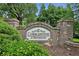 Welcoming 'Cobblestone at Brookhaven' community sign with attractive stone masonry and lush landscaping at 2143 Yancey Ne Ln, Atlanta, GA 30319