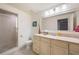Bright bathroom features a marble countertop vanity, tile flooring, and a glass-enclosed shower at 2239 Tayside Nw Xing, Kennesaw, GA 30152