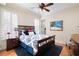 Cozy bedroom features wood floors, plantation shutters, and ample natural light at 2239 Tayside Nw Xing, Kennesaw, GA 30152
