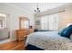 Bedroom boasts hardwood floors, natural light, ensuite bathroom, and stylish furniture at 2239 Tayside Nw Xing, Kennesaw, GA 30152