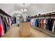 Spacious walk-in closet features custom shelving and a central island with drawers at 2239 Tayside Nw Xing, Kennesaw, GA 30152