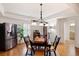 Dining area with stainless steel refrigerator and a view into the bathroom at 2239 Tayside Nw Xing, Kennesaw, GA 30152