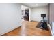 Finished basement with hardwood floors and a stationary bicycle provide an ideal space for a home gym at 2239 Tayside Nw Xing, Kennesaw, GA 30152