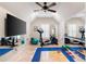 Home gym featuring exercise equipment, mirrors, and a large screen TV at 2239 Tayside Nw Xing, Kennesaw, GA 30152