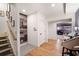 Hallway with hardwood floors, a dartboard, and a glimpse into a living space at 2239 Tayside Nw Xing, Kennesaw, GA 30152