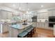 Eat-in kitchen featuring custom cabinets, stainless steel appliances, and center island at 2239 Tayside Nw Xing, Kennesaw, GA 30152