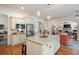 Open concept kitchen features a center island, stainless appliances, and views of the living area at 2239 Tayside Nw Xing, Kennesaw, GA 30152