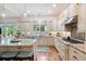 Bright kitchen boasts granite countertops, custom cabinets, and stainless steel appliances at 2239 Tayside Nw Xing, Kennesaw, GA 30152