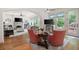 Open concept living space featuring hardwood floors, furniture, and backyard views at 2239 Tayside Nw Xing, Kennesaw, GA 30152