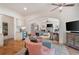 Open concept living space with modern wet bar, archways, hardwood floors, and furniture at 2239 Tayside Nw Xing, Kennesaw, GA 30152