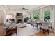 Bright living room with stone fireplace, ceiling fan, modern decor, and hardwood floors at 2239 Tayside Nw Xing, Kennesaw, GA 30152
