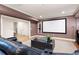 Entertainment room featuring a large projection screen, comfortable seating, and stylish decor at 2239 Tayside Nw Xing, Kennesaw, GA 30152