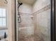 Walk-in shower with tile surround, seating, and modern fixtures at 2239 Tayside Nw Xing, Kennesaw, GA 30152