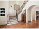 Grand staircase featuring hardwood floors, carpet runner, and custom iron railings at 2239 Tayside Nw Xing, Kennesaw, GA 30152