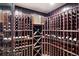 Climate-controlled wine cellar with custom wood racking offers ample storage for wine enthusiasts at 2239 Tayside Nw Xing, Kennesaw, GA 30152