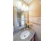 Bathroom featuring a granite countertop, decorative tiles and a large mirror at 3416 Harrison Rd, Atlanta, GA 30344