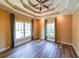 Spacious bedroom featuring a decorative tray ceiling and two windows for ample natural light at 3416 Harrison Rd, Atlanta, GA 30344