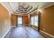 Spacious bedroom with modern flooring, neutral walls, and stylish tray ceiling at 3416 Harrison Rd, Atlanta, GA 30344