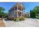 Beautiful two-story home featuring double balconies, lush landscaping and an expansive driveway at 3416 Harrison Rd, Atlanta, GA 30344