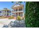 Charming two-story home with double balconies, pretty landscaping, and a convenient driveway at 3416 Harrison Rd, Atlanta, GA 30344
