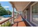 Inviting covered porch features classic columns, wood deck and access to the bright red front door at 3416 Harrison Rd, Atlanta, GA 30344