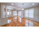 Bright living area features hardwood floors, recessed lighting, pillars, and large windows at 3416 Harrison Rd, Atlanta, GA 30344