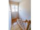 Bright staircase featuring hardwood steps, white railing, and a window with natural light at 3416 Harrison Rd, Atlanta, GA 30344