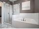 This bathroom features a separate glass shower and large soaking tub at 1580 Johnson Nw Rd, Atlanta, GA 30318