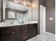 Bathroom featuring a double sink vanity with marble floors and a separate glass shower at 1580 Johnson Nw Rd, Atlanta, GA 30318