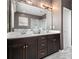 Bathroom with double sink vanity, white quartz countertops, and a large mirror at 1580 Johnson Nw Rd, Atlanta, GA 30318